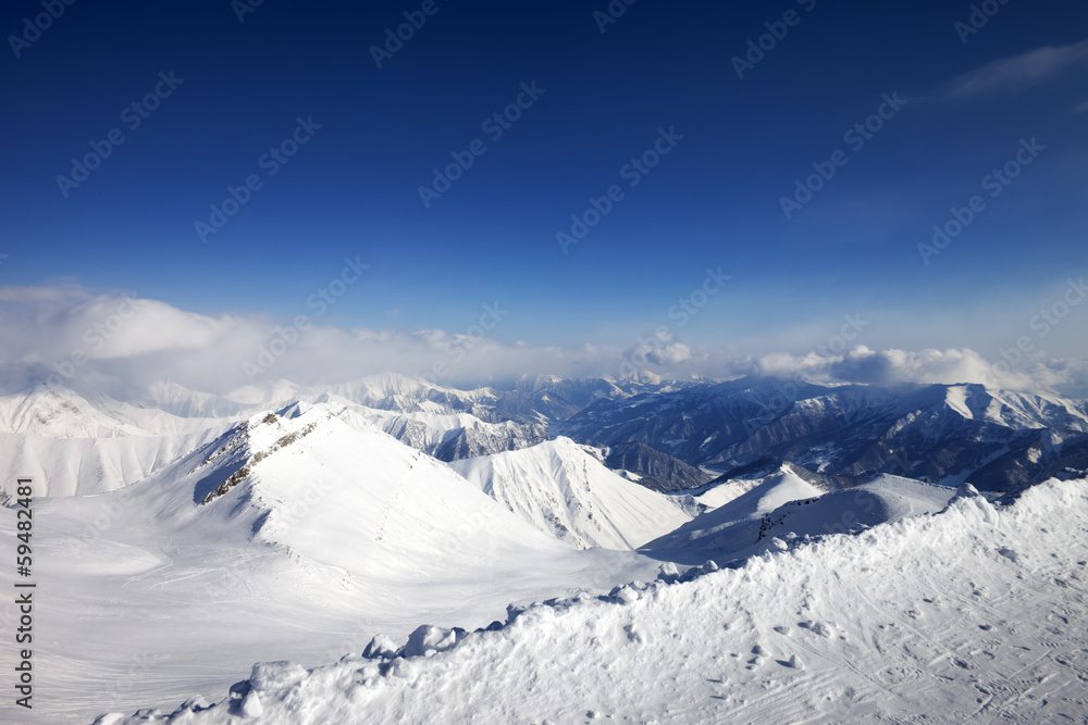 Snowy mountains and off-piste slope at nice day Snowy mountains and off-piste slope at nice day