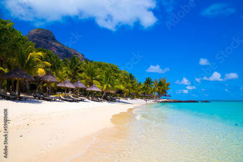 Fototapeta Naklejka Na Ścianę i Meble -  White sandy beach with umbrellas Mauritius