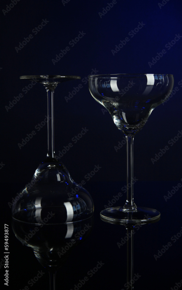 Two glasses on dark blue background Two glasses on dark blue background