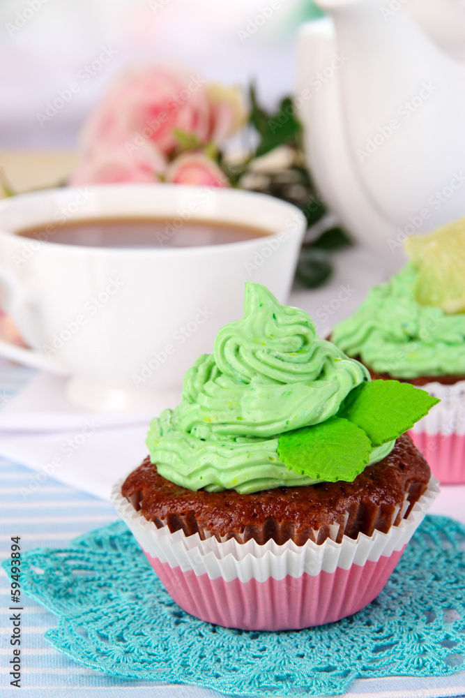 Beautiful cupcakes on dining table on room background Beautiful cupcakes on dining table on room background