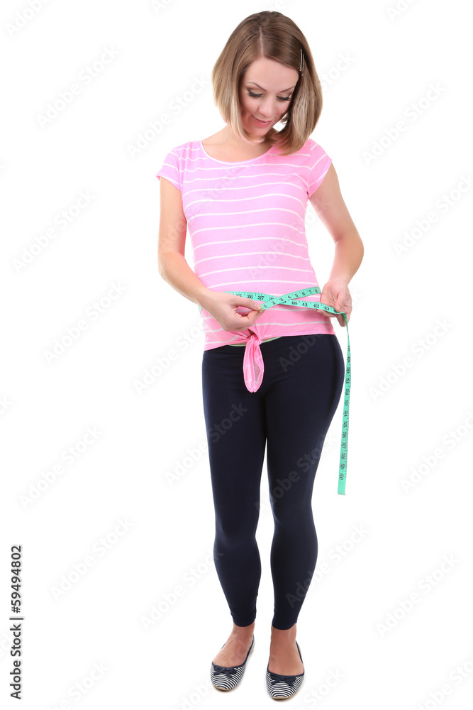 Young pregnant woman measuring her belly isolated on white Young pregnant woman measuring her belly isolated on white
