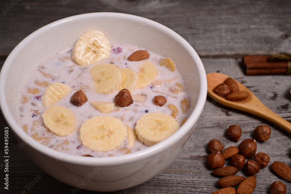 bowl of muesli and millk with fresh banana close up bowl of muesli and millk with fresh banana close up