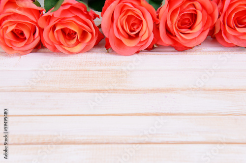 Bouquet of beautiful artificial flowers  on wooden background