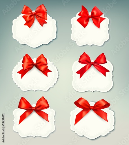 Set of beautiful retro labels with red gift bows with ribbons. V