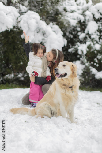 Family with a dog at winter
