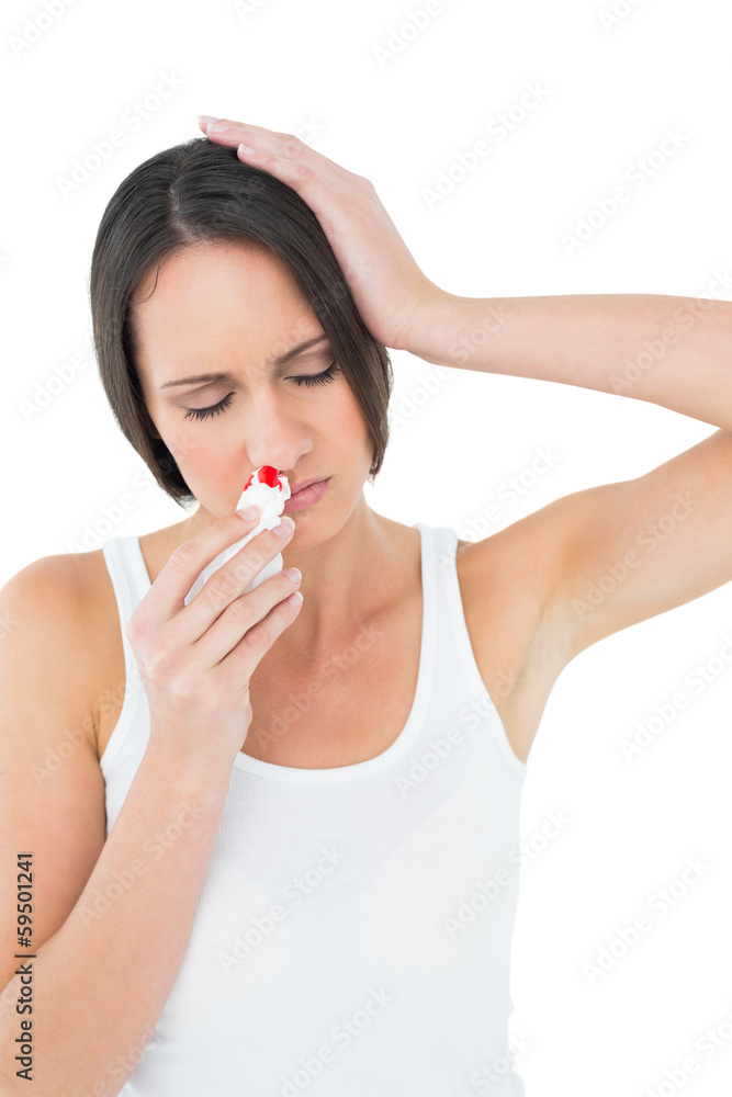 Casual young woman with bleeding nose Casual young woman with bleeding nose
