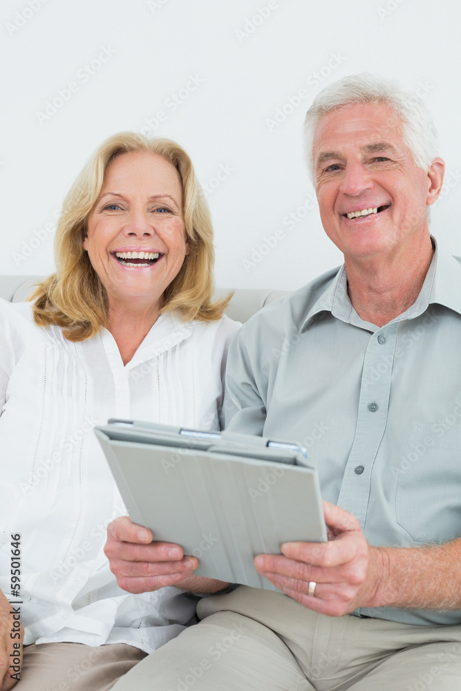 Senior couple with digital tablet at home Senior couple with digital tablet at home