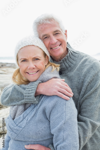 Romantic senior couple on rocky beach