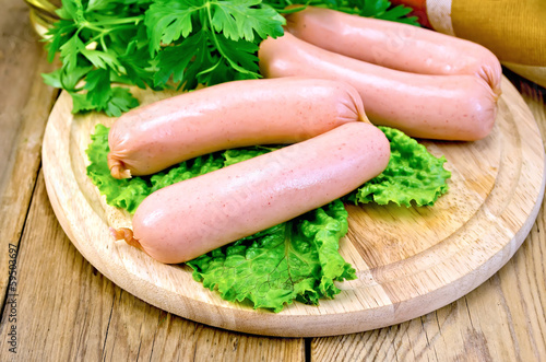 Sausages on board with parsley and napkin