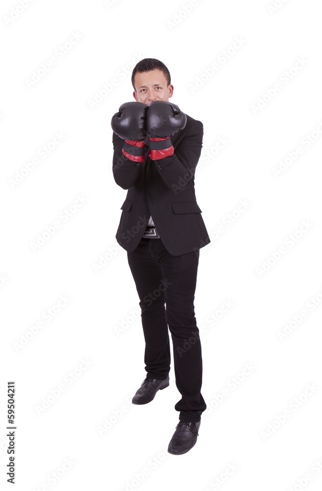 Handsome young businessman posing with boxing gloves Handsome young businessman posing with boxing gloves