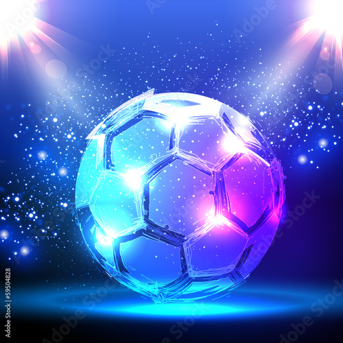 Soccer ball on blue spotlight