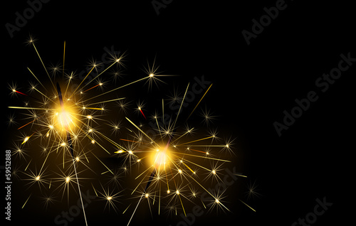 Sparklers burning on a black background