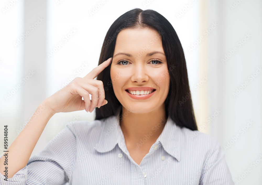 smiling woman pointing to imaginy glasses smiling woman pointing to imaginy glasses