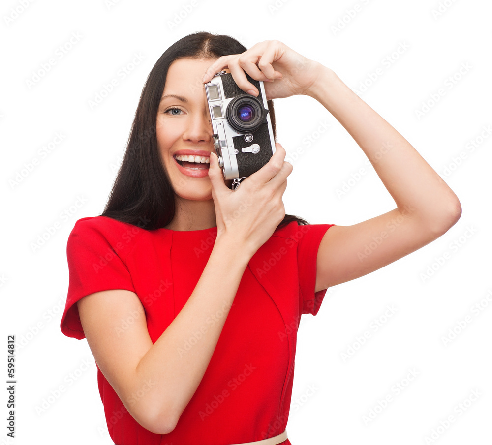 smiling woman taking picture with digital camera smiling woman taking picture with digital camera