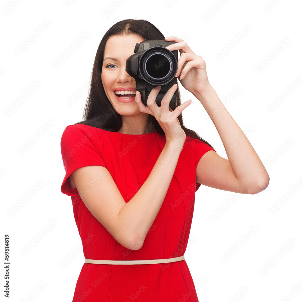 smiling woman taking picture with digital camera smiling woman taking picture with digital camera