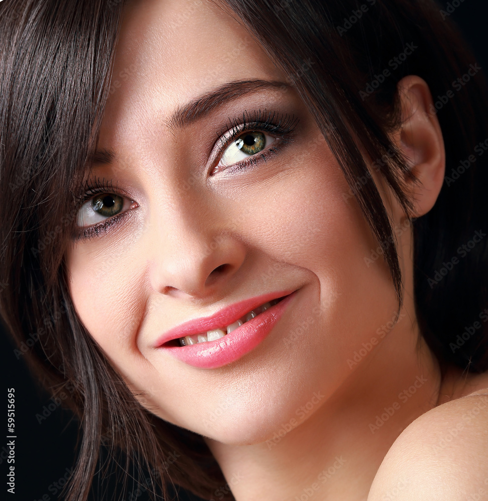 Beautiful smiling makeup woman face. Closeup portrait Beautiful smiling makeup woman face. Closeup portrait