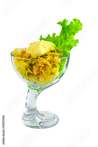 appetizer salad Chips and pickles cheese in a glass beaker