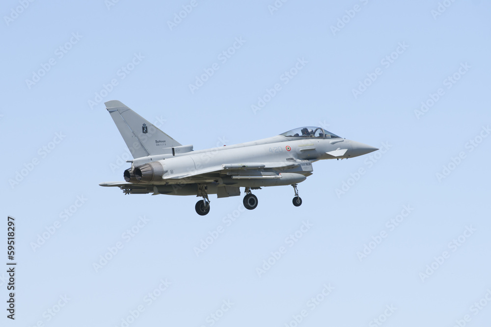 Military fighter jet during demonstration in Albacete air base Military fighter jet during demonstration in Albacete air base