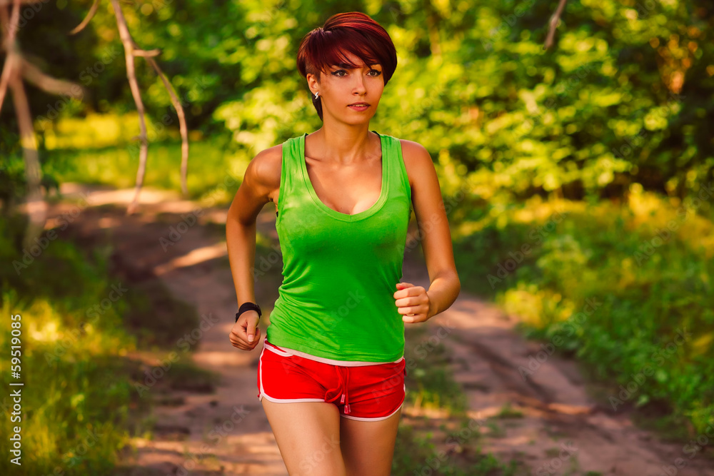 beautiful a healthy runs brunette young woman athlete running ou