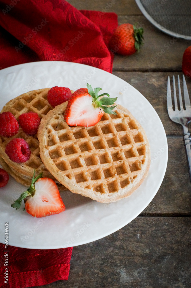 Waffles with strawberries on wooden background Waffles with strawberries on wooden background