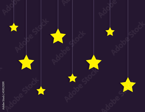 Stars hanging on strings over dark sky background