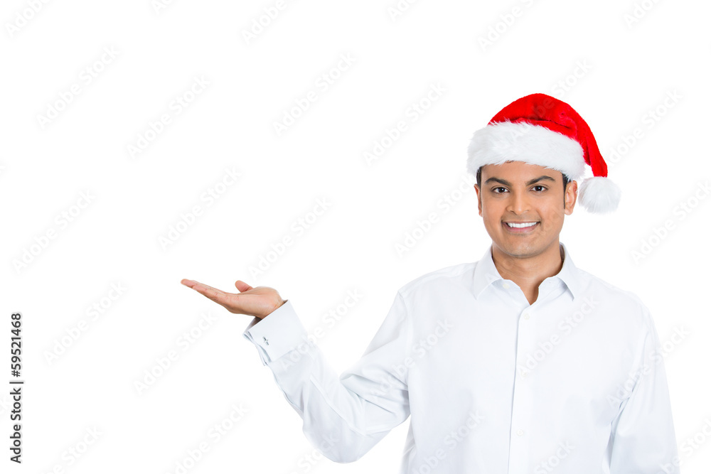 Christmas man smiling pointing at copy pace Christmas man smiling pointing at copy pace