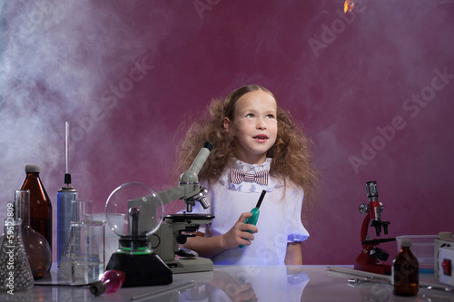 Image of pretty schoolgirl posing in chemistry lab