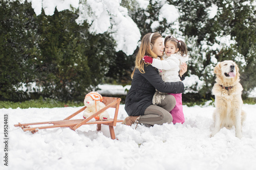 Family with a dog at winter