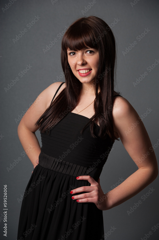 Young smiling woman in black dress Young smiling woman in black dress