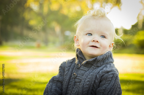 Adorable Blonde Baby Boy Outdoors at the Park.