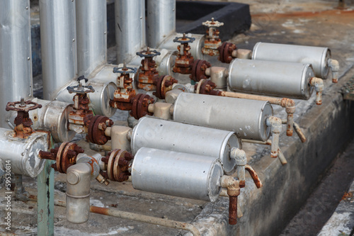 close-up of old steam trap valve on pipe connection