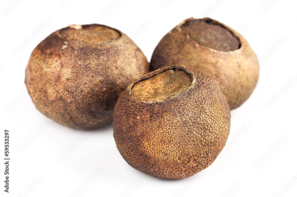 Fototapeta premium Dried mandarins with black puer tea inside isolated on white