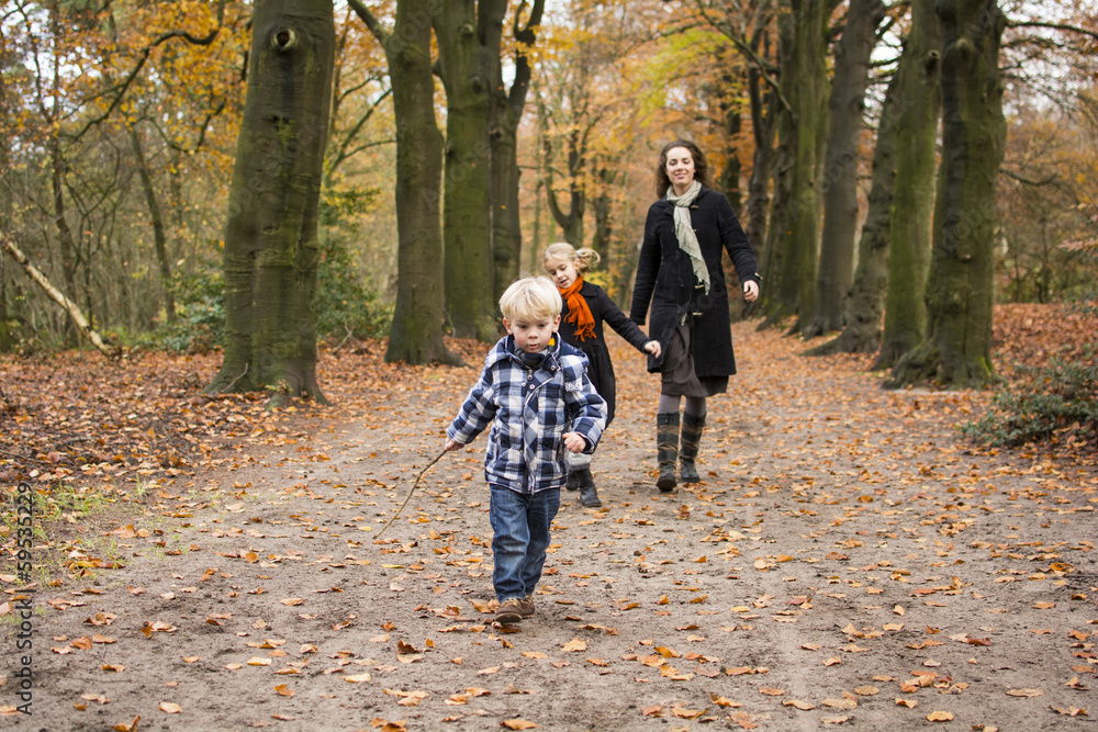 Fototapeta premium Boy and family in woods or forest