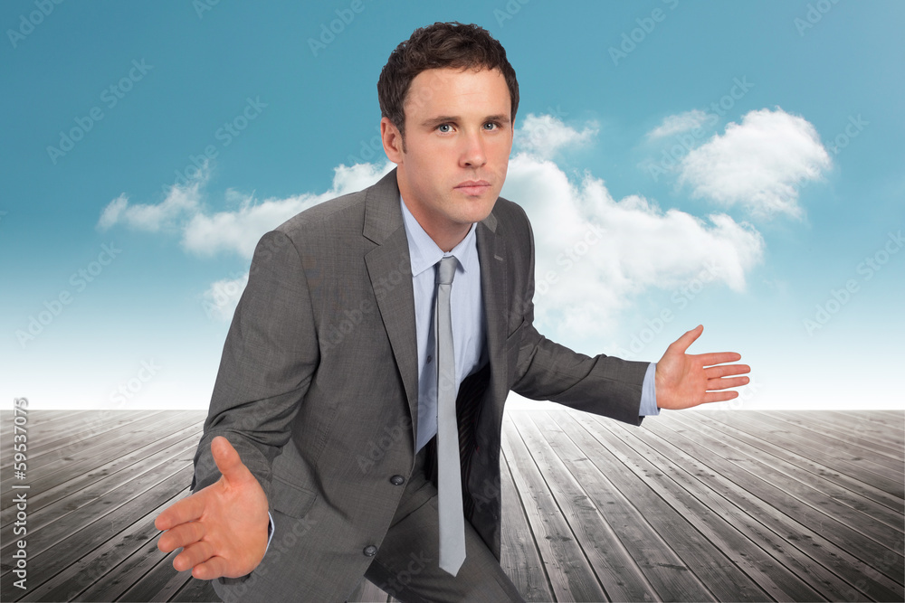 Composite image of businessman posing with hands out Composite image of businessman posing with hands out
