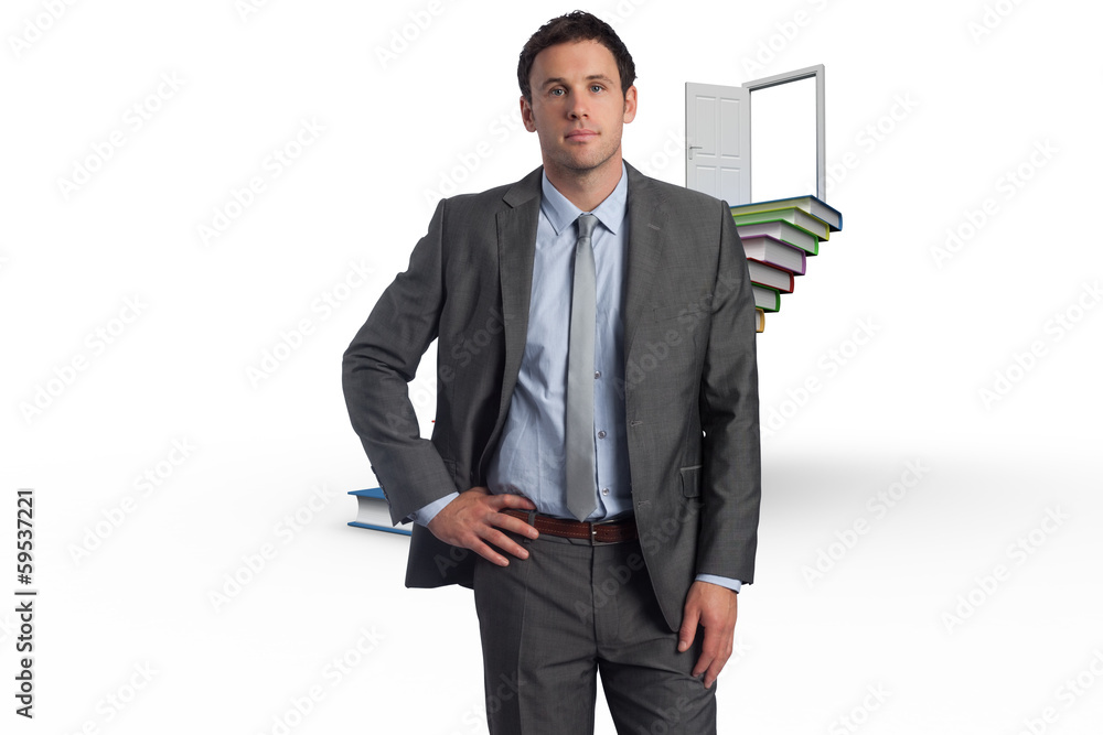 Composite image of serious businessman with hand on hip Composite image of serious businessman with hand on hip