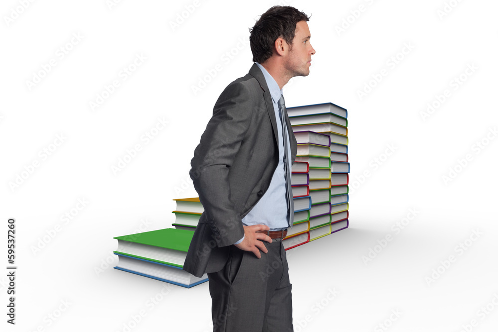 Composite image of serious businessman with hands on hips Composite image of serious businessman with hands on hips