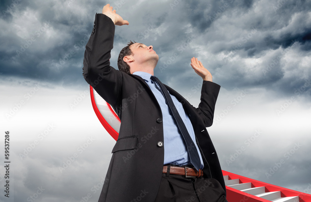 Composite image of businessman posing with arms raised Composite image of businessman posing with arms raised