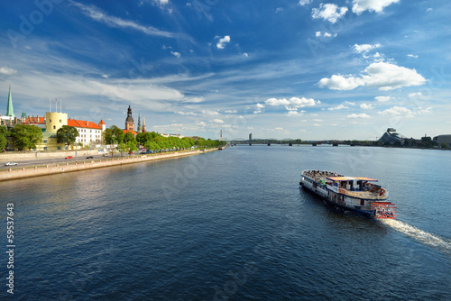 general view on Riga embarkment and river ships in bright sunny