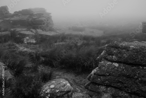 Landscape over Dartmoor National Park in Autumn with rocks and f