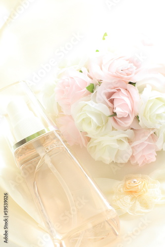 bottle of spray and flower for facial cosmetic image