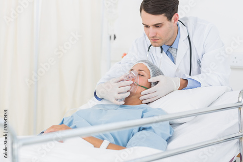 Female patient receiving artificial ventilation