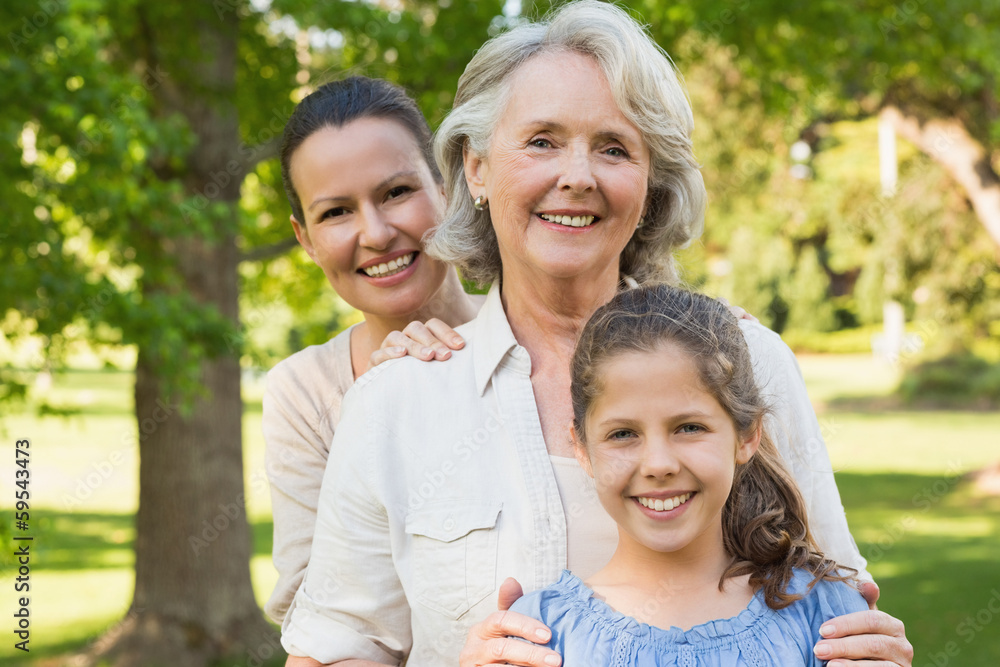 Woman with grandmother and granddaughter at park Woman with grandmother and granddaughter at park