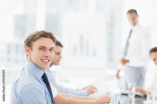 Wallpaper Mural Smiling businessman looking at camera during a meeting Torontodigital.ca