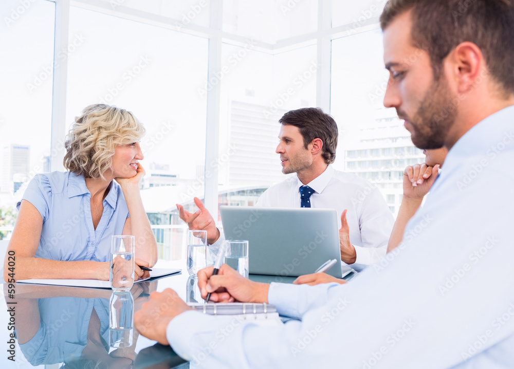 Executives sitting around conference table Executives sitting around conference table