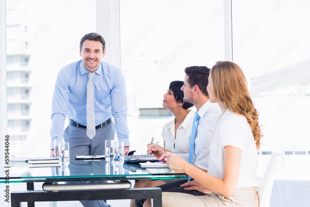 Fototapeta premium Executives around conference table in office