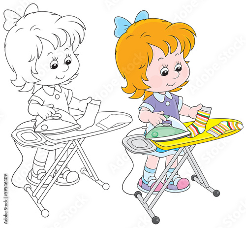 Little girl doing the ironing