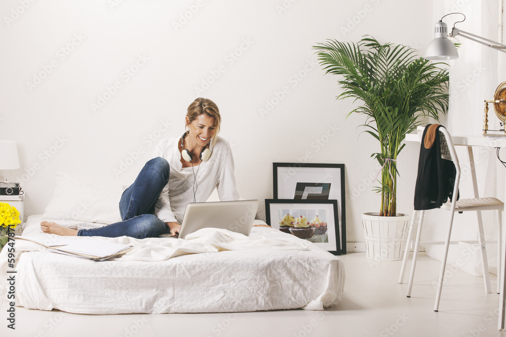 Mature businesswoman working with laptop at home. Mature businesswoman working with laptop at home.