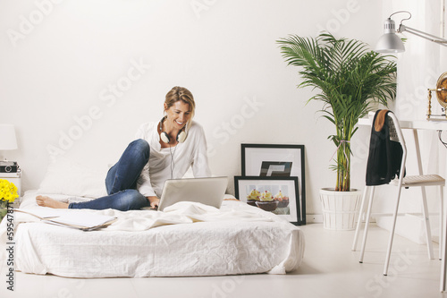 Mature businesswoman working with laptop at home.