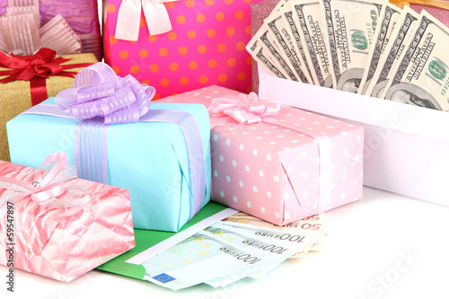 Fototapeta Naklejka Na Ścianę i Meble -  Gift boxes with money close up