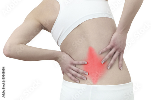Acute pain in a woman back. Female from behind holding hand to s